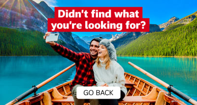 Didn't find what you're looking for? Go back. | couple taking a selfie in a rowboat on Lake Louise in Canada