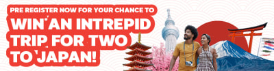 Couple smiling, looking at Japanese architecture and Mount Fuji featuring a callout to win an Intrepid trip for two to Japan