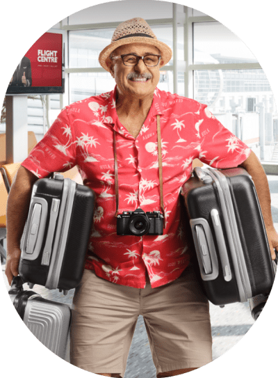 Dad in airport carrying multiple suitcases