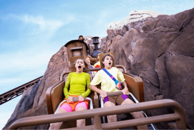 Teens screaming with excitement aboard the Expedition Everest roller coaster at Disney's Animal Kingdom