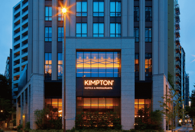 The Kimpton Hotel in Tokyo lit up at dusk