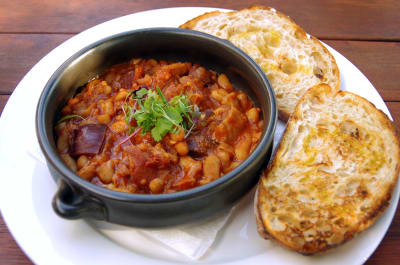 Boston baked beans with smoked ham hock, chorizo and chilli served with toasted sourdough bread