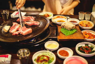 Korea takes BBQ to a new level with sizzling pork belly enjoyed best with aside of kimchi