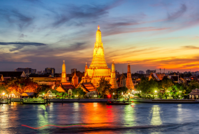 Wat Arun Buddhist religious places lit up at twilight, Bangkok, Thailand