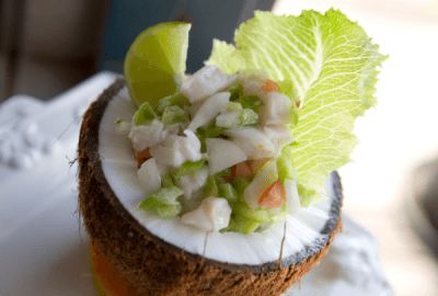 Marinated fish salad served in coconut