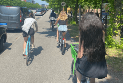 Cyclists riding down a footpath in suburban Copenhagen