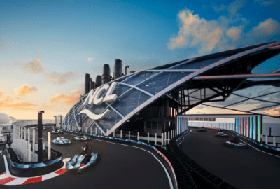 Go-karts dart round the funnel of an NCL cruise ship