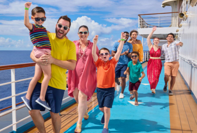 Jubilant families walking on the deck of a cruise ship