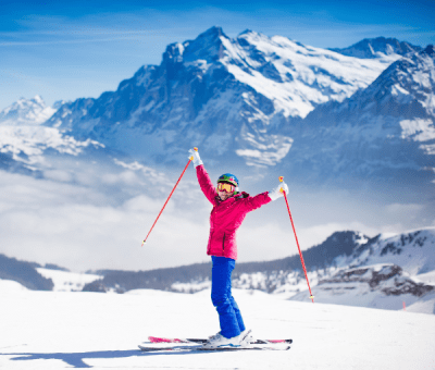 Woman skiing on snowy mountain