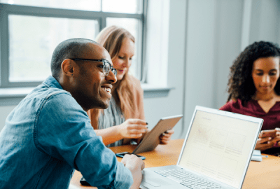 Business people using technology in meeting