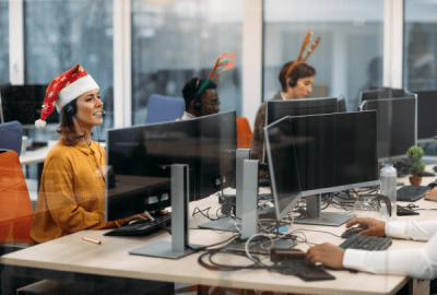 Call centre staff wear Santa hats and reindeer antlers as they work through Christmas