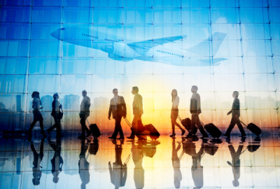 Group of Business Travellers Walking in an Airport