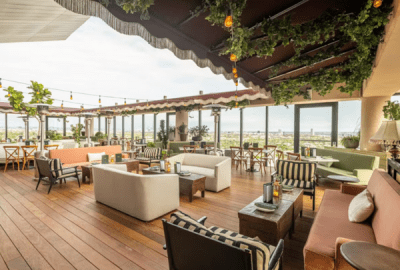 Open-air tables and chairs at Harriet's Rooftop Bar in West Hollywood