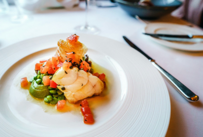 A yummy seafood dish stacked on a big white plate