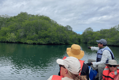 A group tour aboard a boat off the Galapagos Islands.