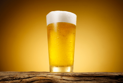 Close-up of a frothy beer in a chilled glass