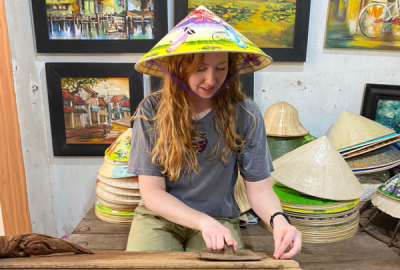 Emma rolling incense in Hue