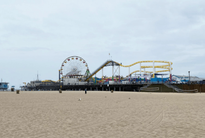 A theme park stretches over the sand on the Santa Monica Pier