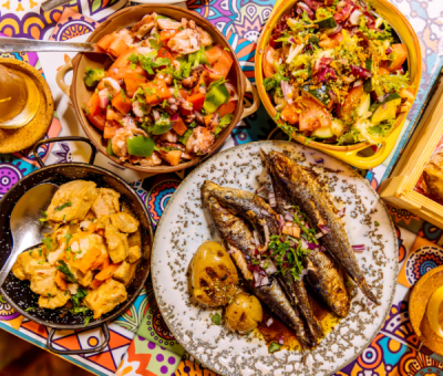 Traditional Portuguese dinner with griller sardines and octopus salad