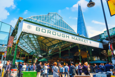 People mill around Borough Market in Southwark, London