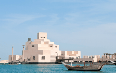 Unique architecture of the Museum of Islamic Art and a boat on Doha's waterfront