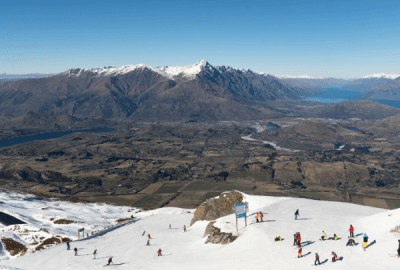 Skiers on the slope of the Coronet Peak ski resort near Queenstown in New Zealand