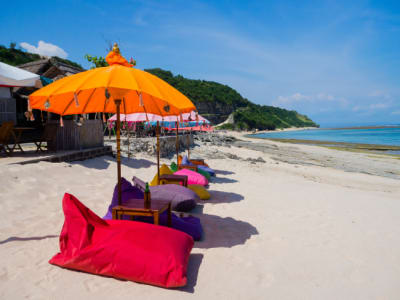 Colourful chairs and umbrellas on Pandawa Beach, Bali, Indonesia