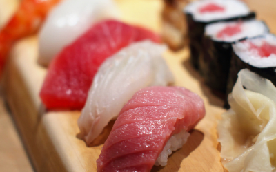 A selection of sushi plated up and ready to eat.