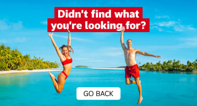 Didn't find what you're looking for? Go Back. Two people in red swimsuits jumping for joy in front of the ocean