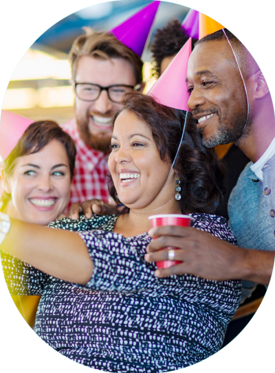 Corporate colleagues with party hats