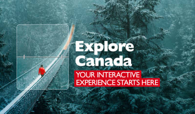 Explore Canada - Your interactive experience starts here. Person in red coat walking across a rope bridge in a snowy forest