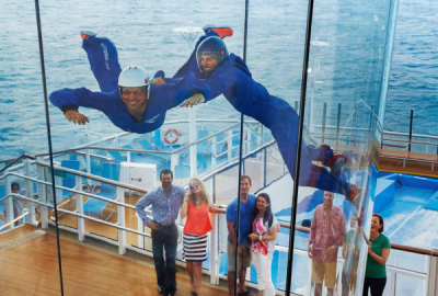 Two people indoor skydive high on deck