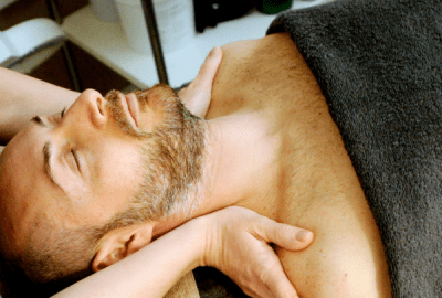 A man receives a shoulder massage