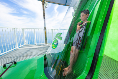 A boy gets ready to ride the Green Lightening water slide aboard the cruise ship Carnival Splendor