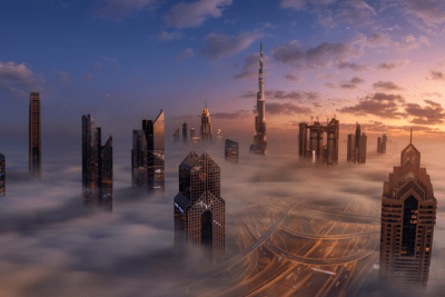 A low fog hangs beneath the Dubai cityscape