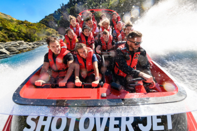 Passengers on the Shotover River jetboat get sprayed with water, Queenstown NZ.