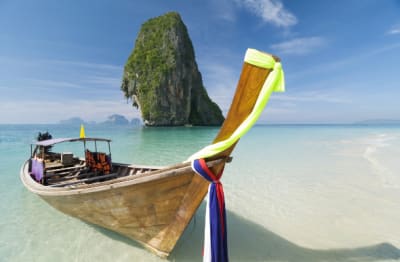 Wooden boat docked on Railay beach