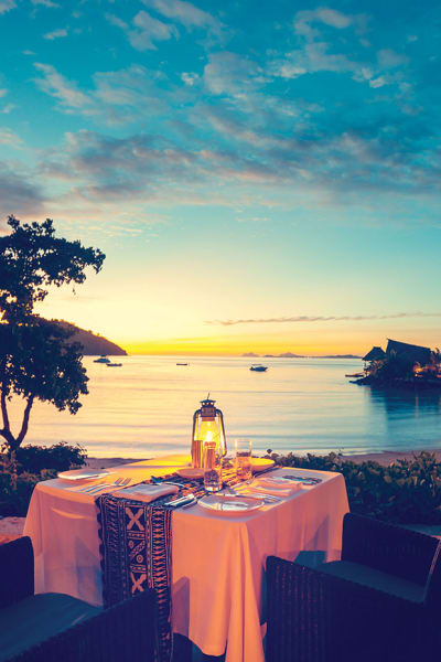 Luxury bungalows on the edge of a beach in Fiji