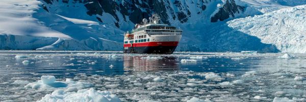 Hurtigruten ship surrounded by ice caps