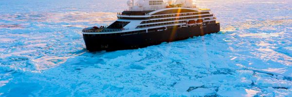 Ship cruising through glaciers