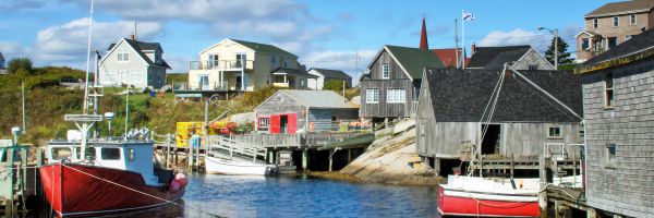 Fishing town with weathered buildings, fishing boats and a church