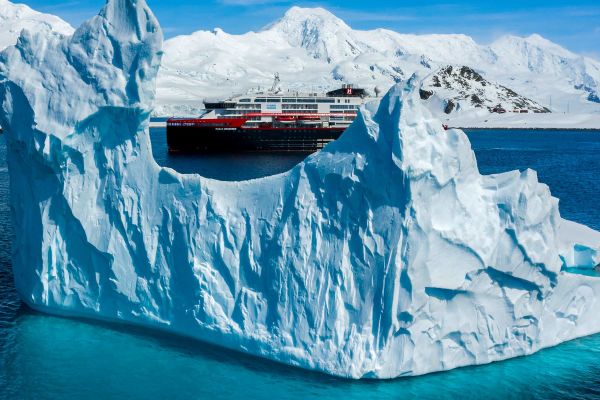 Hurtigruten ship surrounded by glaciers