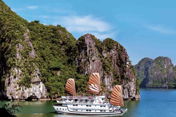 Smaller cruise ship cruising through Ha Long Bay