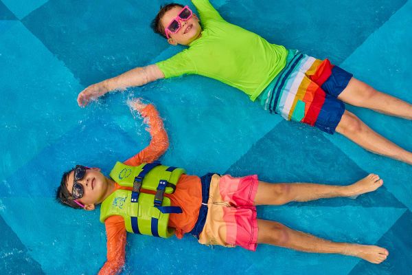 Kids floating in pool