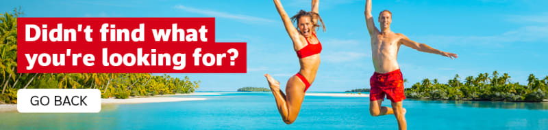 Didn't find what you're looking for? Go Back. Two people in red swimsuits jumping for joy in front of the ocean