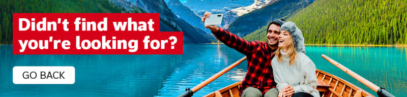 Didn't find what you're looking for? Go Back | Couple in a rowboat taking a selfie with pine tree forests and snowy mountains in the background