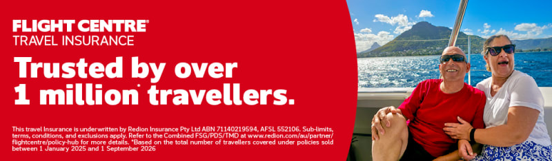 Couple smiling on a cruise yacht, celebrating Flight Centre Travel Insurance trusted by over 1 million travellers