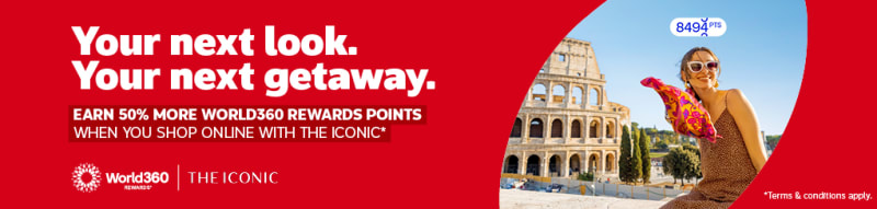 Woman with a colourful scarf sitting next to the Colosseum featuring a World360 Rewards and Iconic partnership