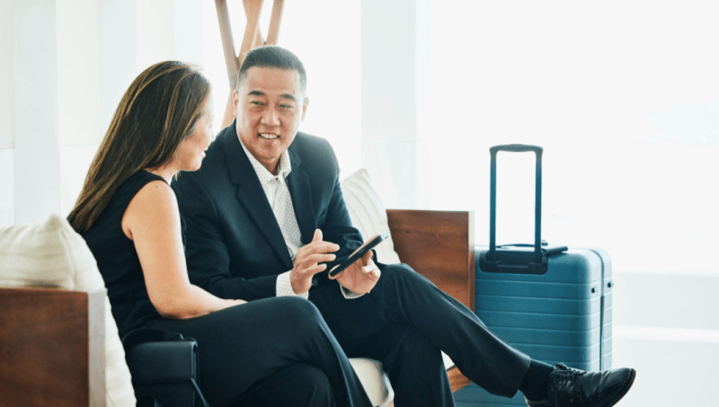 Business travellers on work trip with luggage