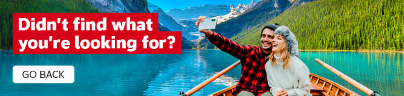 Didn't find what you're looking for? Go back. | couple taking a selfie in a rowboat on Lake Louise in Canada